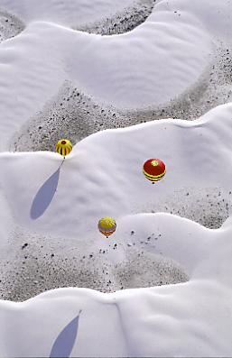 balloons over white sands